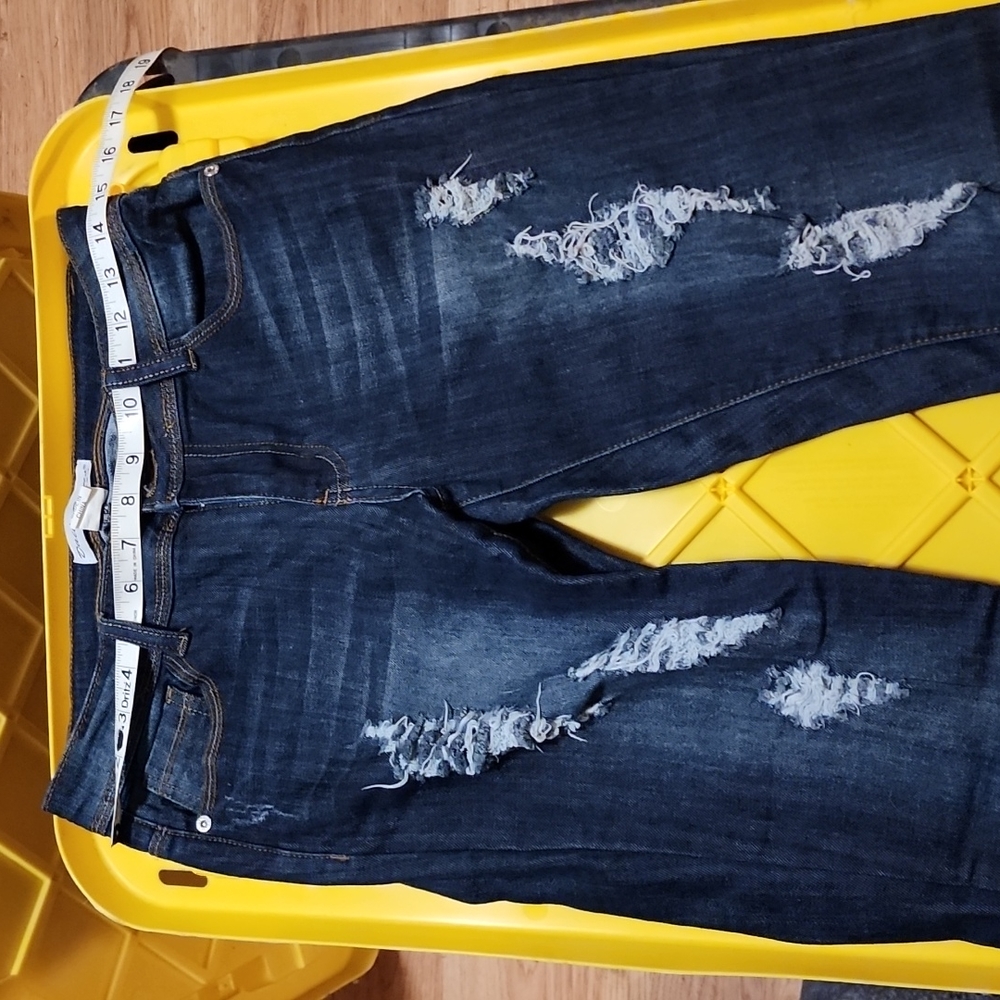Dark wash distressed denim jeans